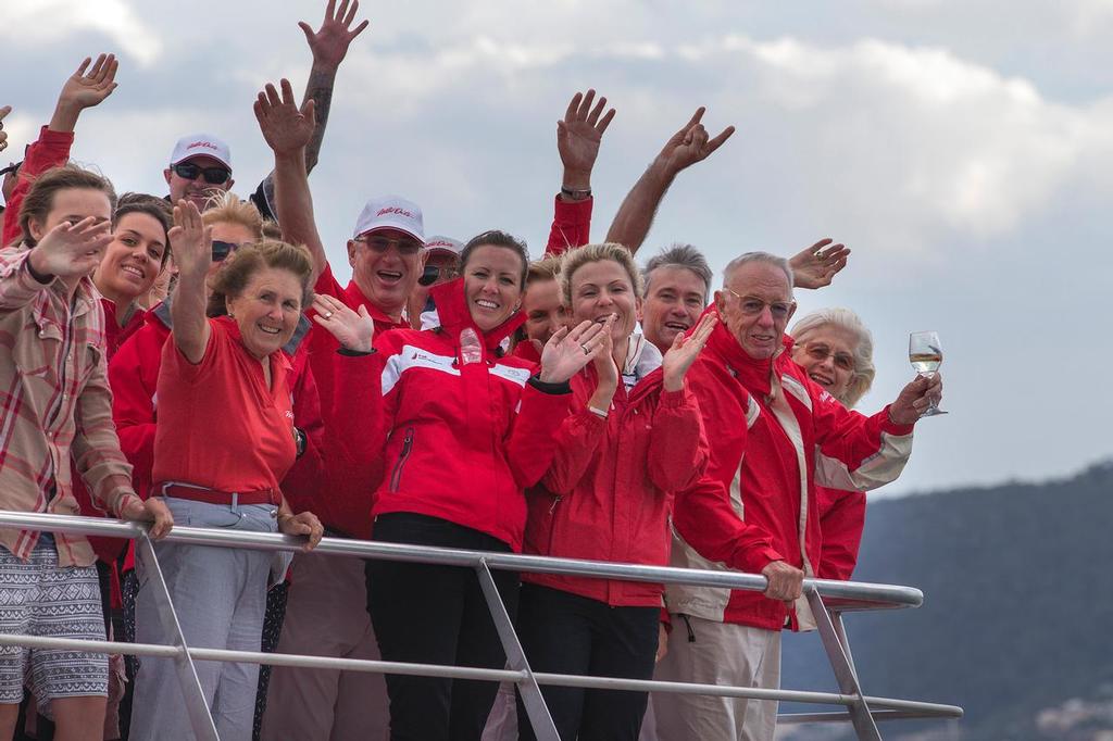 A Happy Man: Bob Oatley, with wine in hand, along with family and friends, salutes Wild Oats XI at the finish of the Rolex Sydney Hobart race 2013 © Andrea Francolini